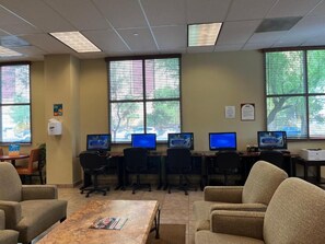 A conference room with multiple computer workstations, chairs, and a table. - Condo in fantastic Las Vegas with pools, spas and National Rodeo Finals week. A. (Las Vegas)