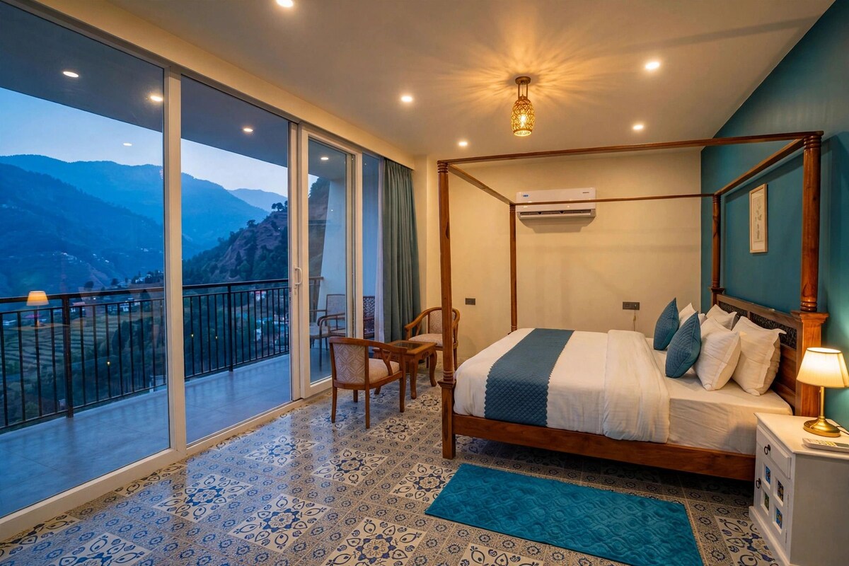 A four-poster bed with a view of mountains through large sliding doors.