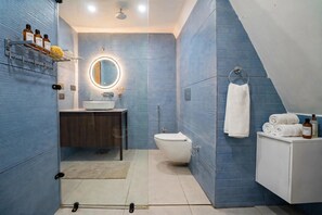 A modern bathroom with a vanity, sink, mirror, and toilet. - Raj Villas by Jomotel, Riverside Retreat (Palach)