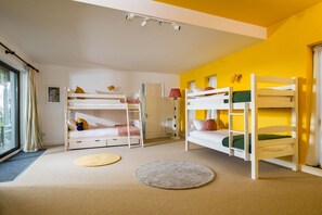 A children's room with bunk beds, a window with curtains, and a lamp. - Little Acres - sleeps 12 guests  in 5 bedrooms (Marazion)