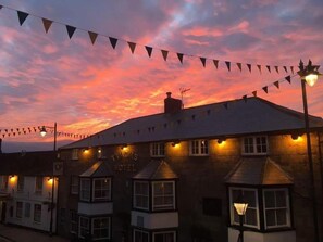 A building with a sign reading 'The Locks Hotel' under a twilight sky. - Tyacks Hotel (Camborne)