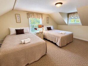 A room with two beds, a nightstand, and a window with curtains. - Wiley Inn | Peaceful 2BR Retreat in the Green Mountains (Peru)