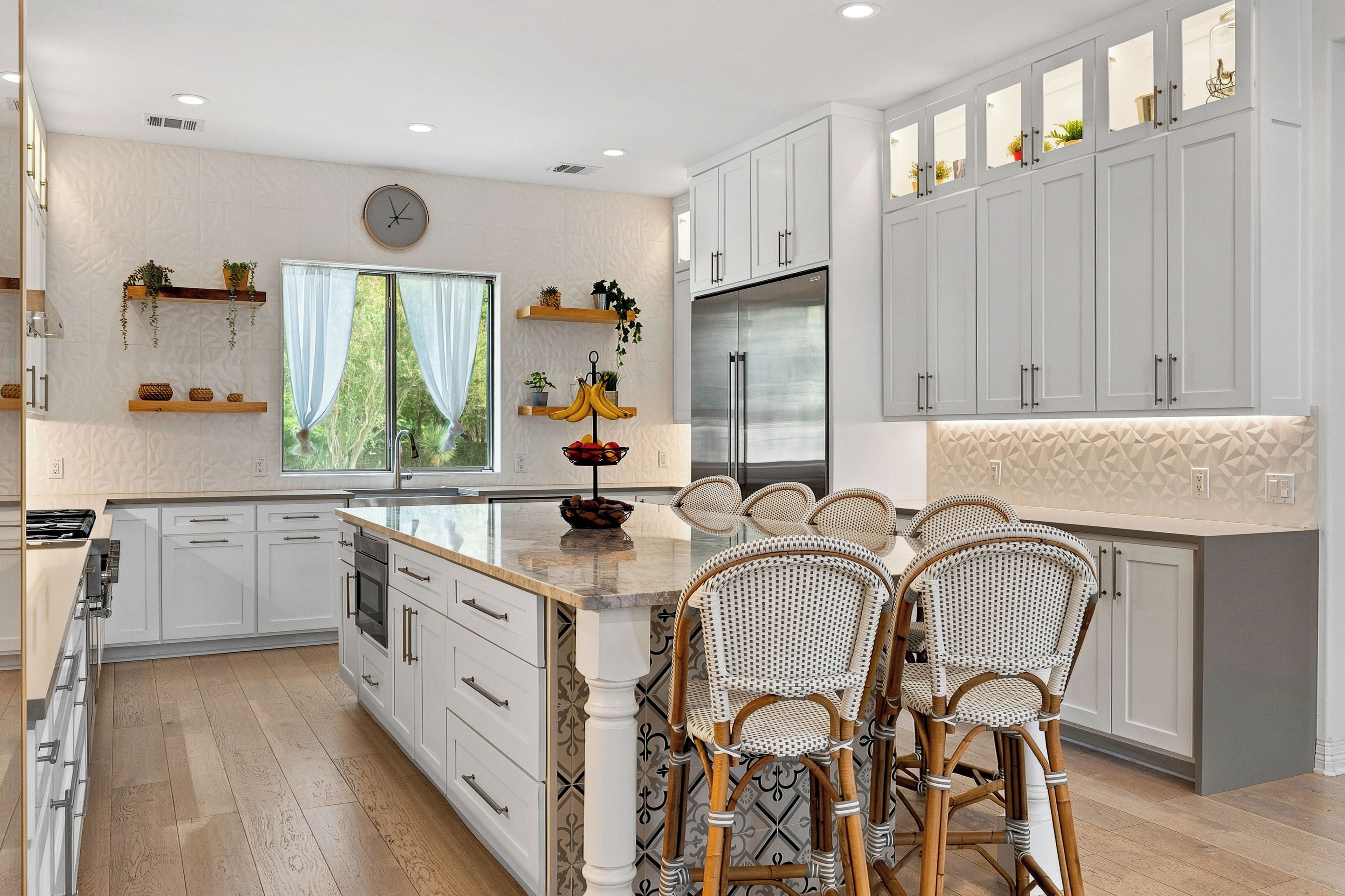 Gather around the oversized island in the chef's kitchen.