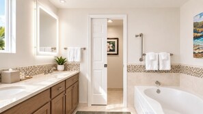 A modern bathroom with a bathtub, a sink, and a mirror. There is a door leading to another room. - Marriott's Gorgeous Beachfront Waiohai Club Resort + Resort Amenities Included (Koloa)