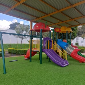 A playground with multiple slides and swings. - 5 Min to Hot Springs • Family Home with Hammock (Ahuachapán)