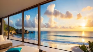 A modern room with a large window overlooking a beach, a sofa, and a plant. - Laika Boutique Stay (Sanya Bay) (Sanya)