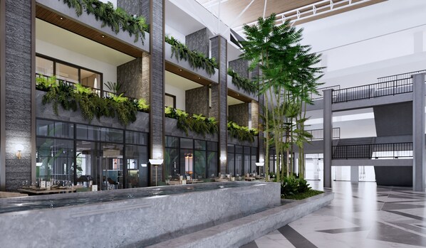 A modern building with multiple floors, large windows, and indoor plants. - Swiss-Belhotel K Square Batam (Batam)