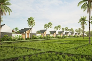 A row of modern villas with a well-maintained garden and palm trees. - Athene Villa Seseh (Badung)