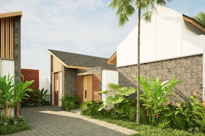 A modern residential building with a paved entrance, a brick entrance, and a variety of tropical plants. - Athene Villa Seseh (Badung)