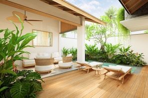 A modern outdoor lounge area with wooden flooring, white sofas, and a pool. - Athene Villa Seseh (Badung)