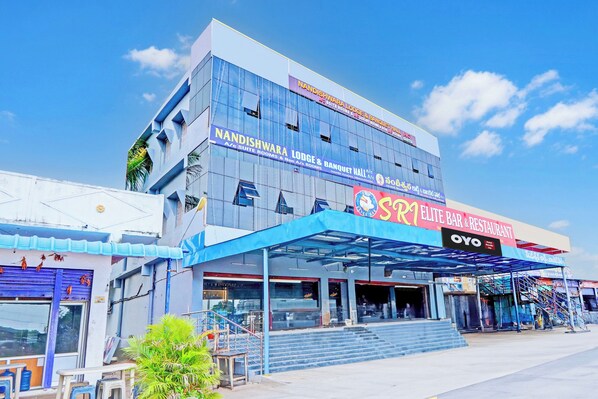 A hotel with multiple floors, including a visible bar and restaurant on the ground level.