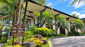 A hotel lobby with directional signs to various amenities including the lobby, café marco, café gabriel, laud room, amianan room, and bagatan hall.