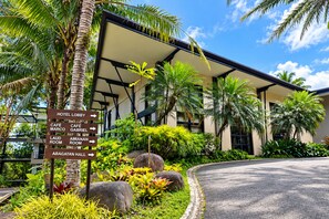 A hotel lobby with directional signs to various amenities including the lobby, café marco, café gabriel, laud room, amianan room, and bagatan hall.