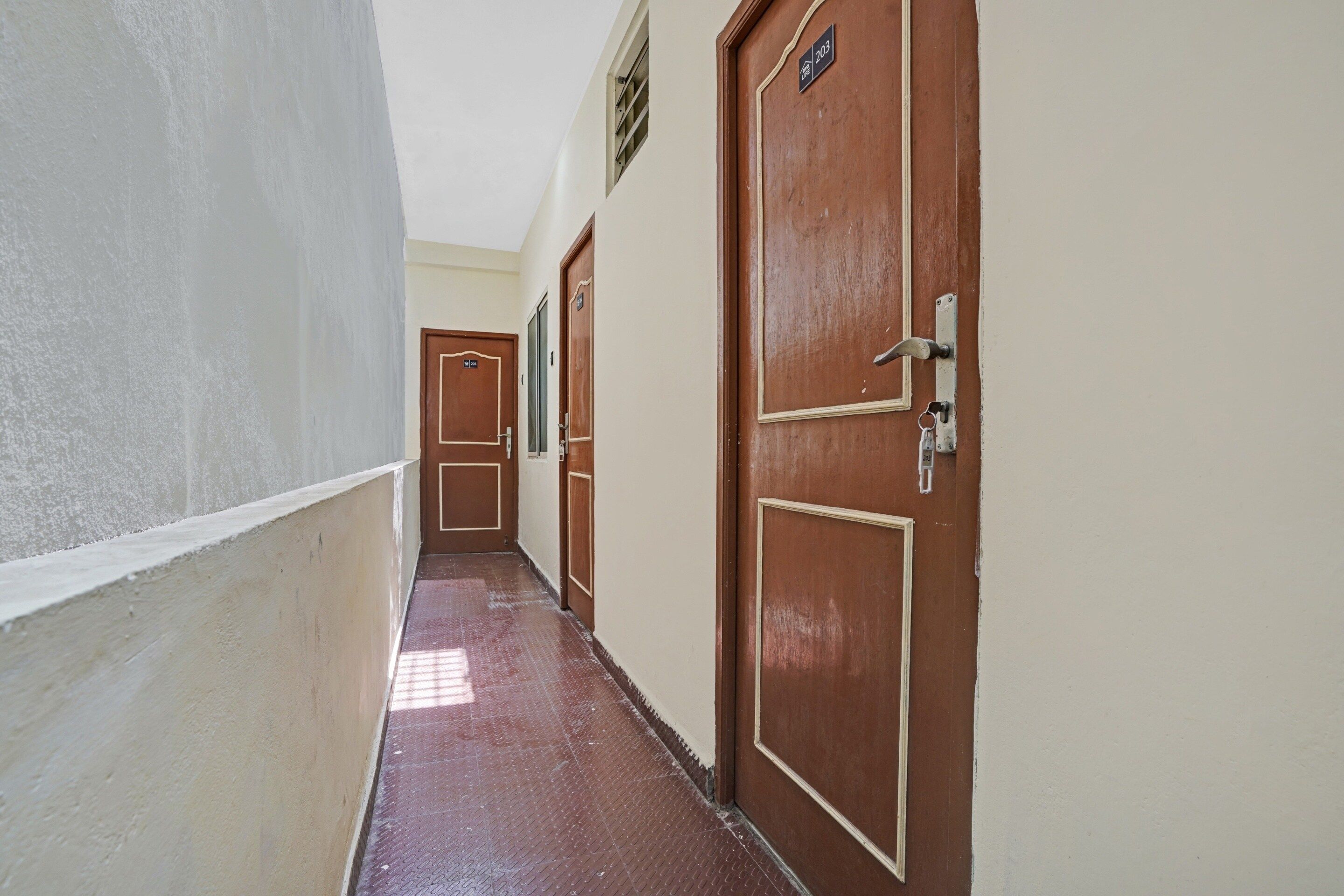 A corridor with doors, each marked with a number.