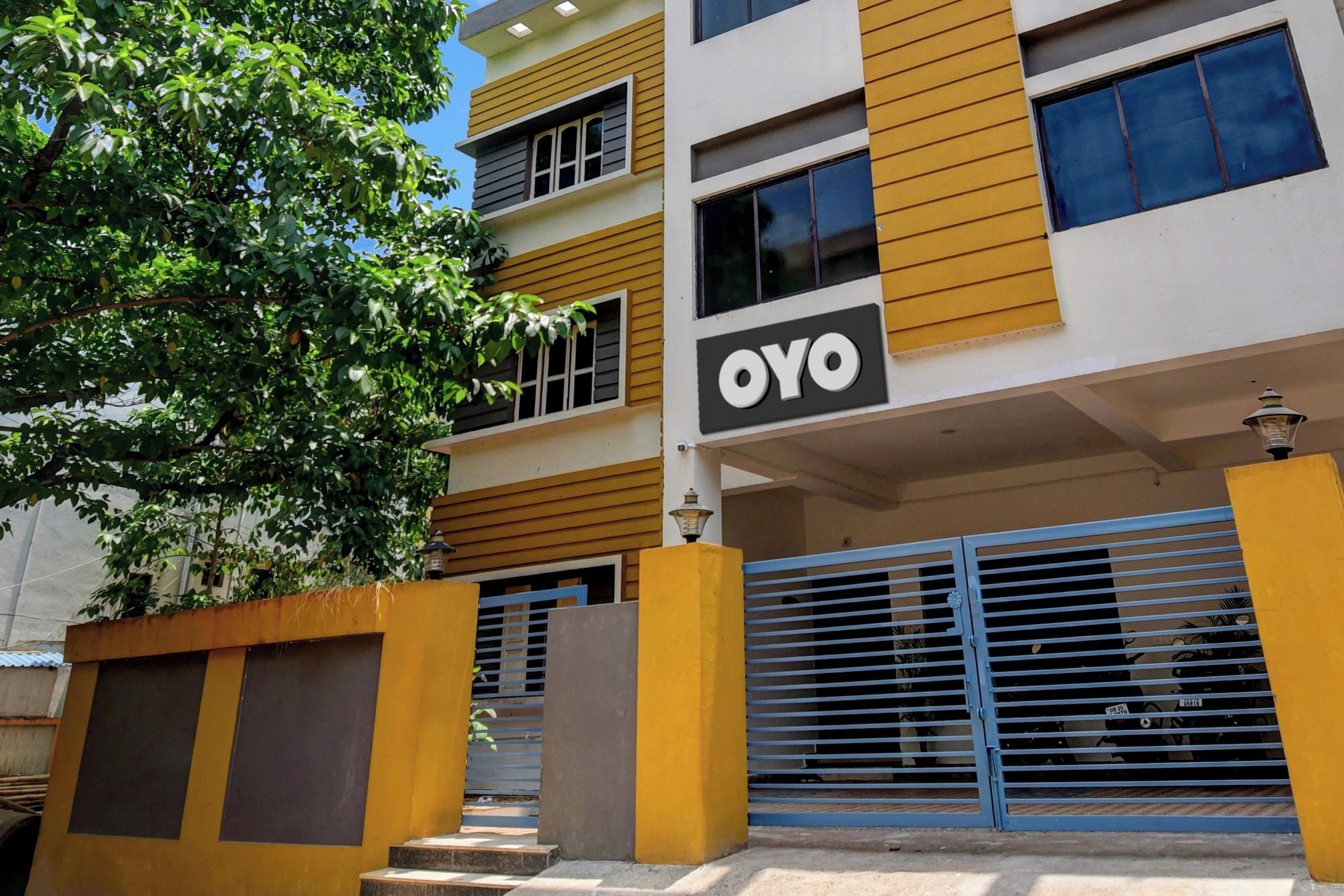 A multi-story building with a sign reading 'OYO' on the facade.