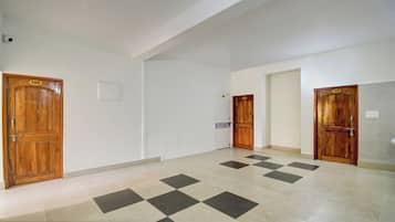 A hallway with wooden doors numbered 106, 107, 108, and 109, leading to individual rooms.