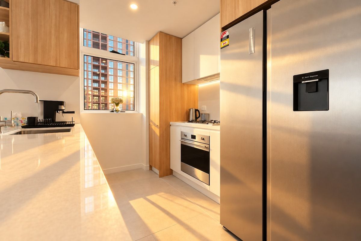 Prepare your favourite meals in our modern kitchen with sleek cabinetry and built-in appliances.