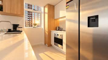 Prepare your favourite meals in our modern kitchen with sleek cabinetry and built-in appliances.