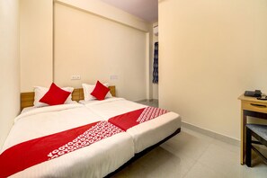 A hotel room with a bed, a desk, and a telephone. - Hotel O JV Colony Near KFC Gachibowli (Hyderabad)
