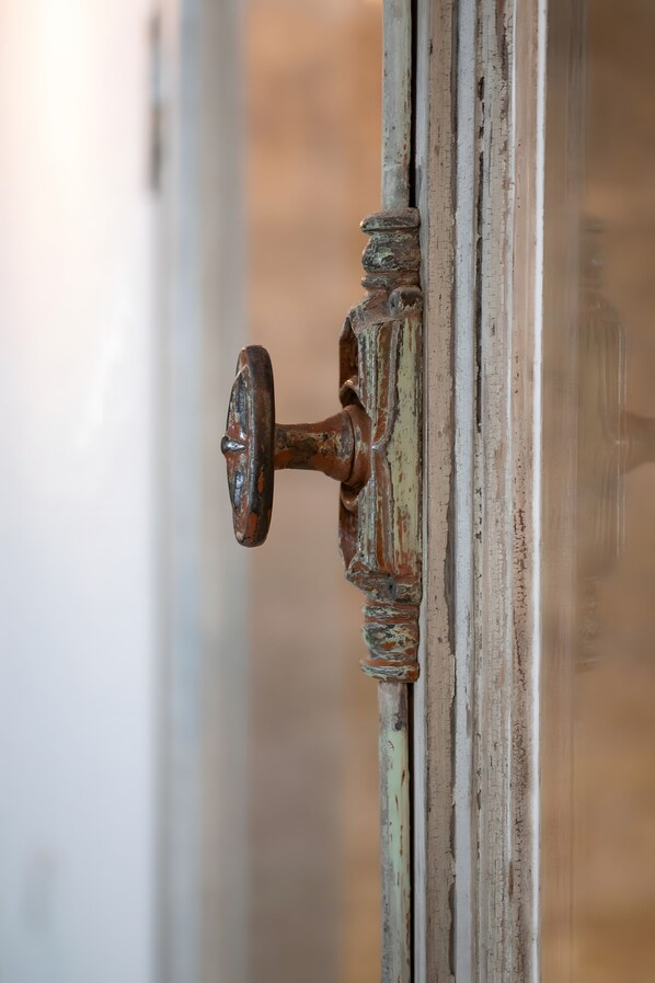 A close-up of a weathered door handle.
