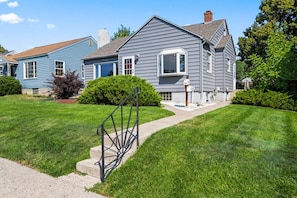 A residential property with a well-maintained lawn, a metal gate, and a clear sky. - Bright 3BR Home Near MetraPark & Downtown Billings (Billings)
