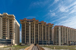 A high-rise hotel with multiple balconies and a central atrium. - Phoenix Ii 2035 2 Bedroom Condo (Orange Beach)