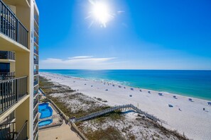 A beachfront hotel with a swimming pool, beach, and ocean view. - Phoenix Ii 2097 2 Bedroom Condo (Orange Beach)