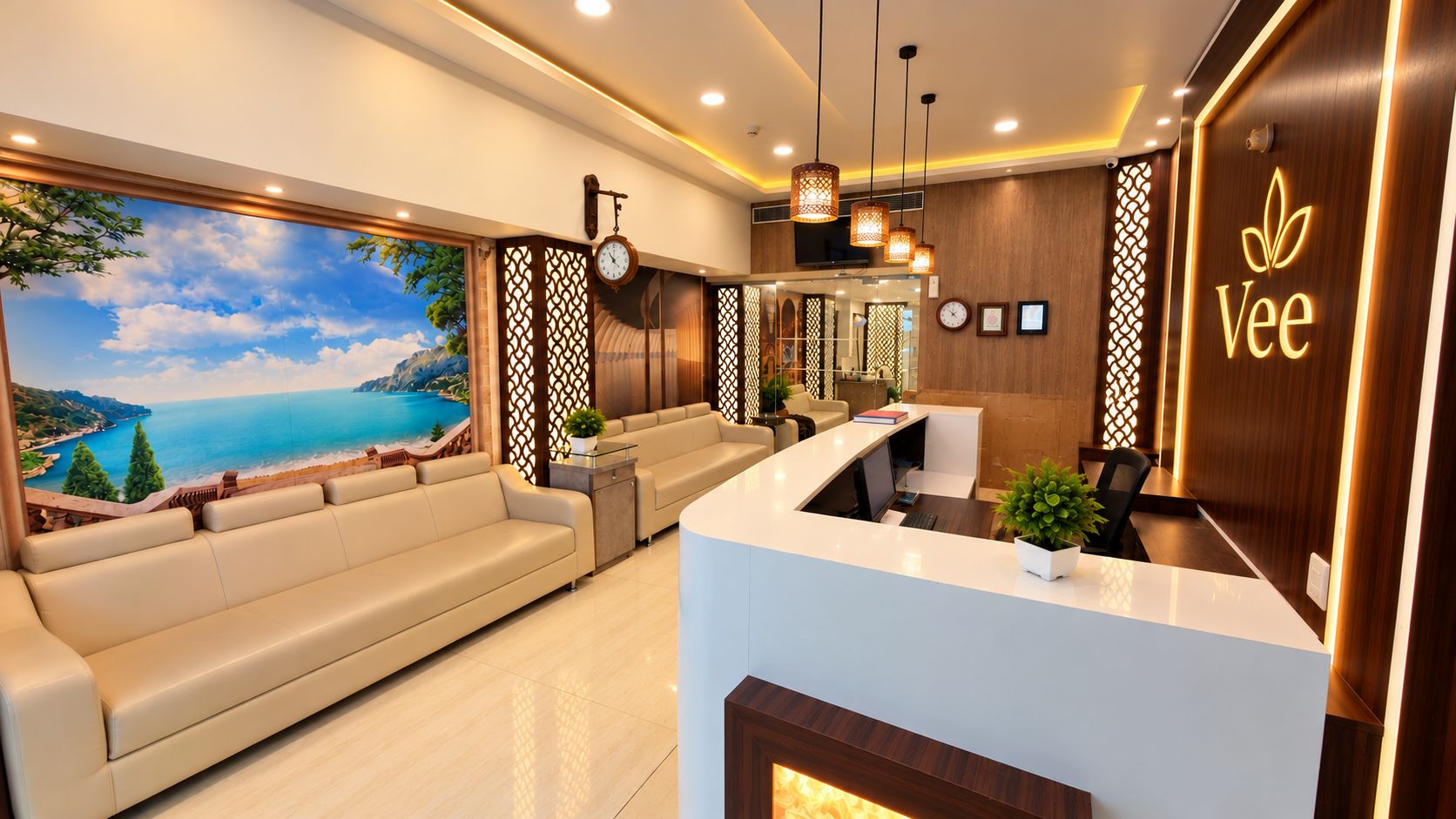Un área de recepción moderna con un sofá, un mostrador de recepción y vista al mar.