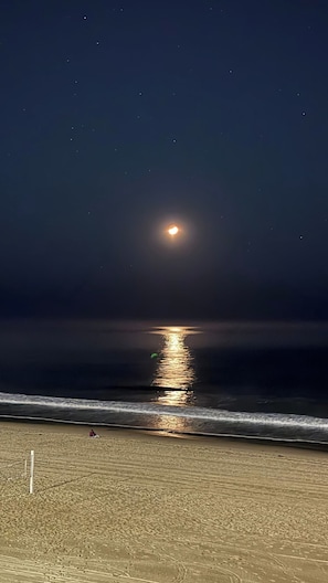 A beach at night with a visible moon reflection on the water. - Ocean Haven | Beachfront Getaway by Redondo Pier (Redondo Beach)