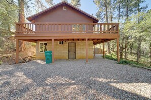 A two-story wooden cabin with a balcony, surrounded by trees. - Cozy Prescott Cabin, Surrounded By Ponderosa Pines (Prescott)