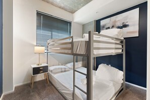 Modern bunk room with cozy bedding—great for families or groups - Chic 2BR | Pool | W/D | Wi-Fi Near Arts District (Phoenix)