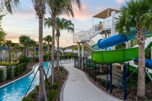 A water park with a pool, slides, and a covered area. - Luxury 5BR Villa w/ Pool & Themed Rooms (Davenport)