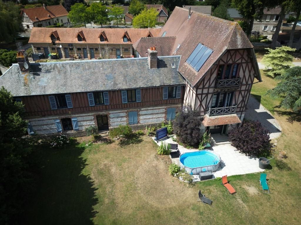 A large house with a swimming pool and a garden.