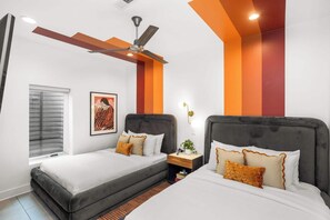 A modern bedroom with two beds, a ceiling fan, and a window with blinds. - 10 Beds | Minutes to Broadway, Gulch & 12 South (Nashville)