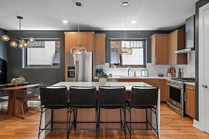 Beautiful Kitchen with Island Seating and Dining Table - Unwind in Opulence 4BR 4BA Near Bway! (Nashville)