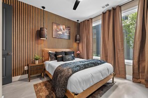 Bedroom 1: Queen Bed, Wood-Slat Accent Wall + Barrel Pendant Lights - Bourbon & Ballads: Karaoke Stage, Sauna + Rooftop (Nashville)
