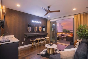 Living Room 4: Top level Hangout area with bar/makeup station, wet bar, Smart TV and Sleeper Sofa - Sleeps 24 | Rooftop Decks Downtown Views (Nashville)