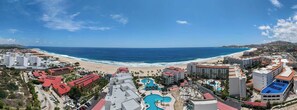 A coastal resort with multiple buildings, a beach, and a swimming pool. - 2BR Beachfront Condo With Pool Access & Terrace ! (San José del Cabo)