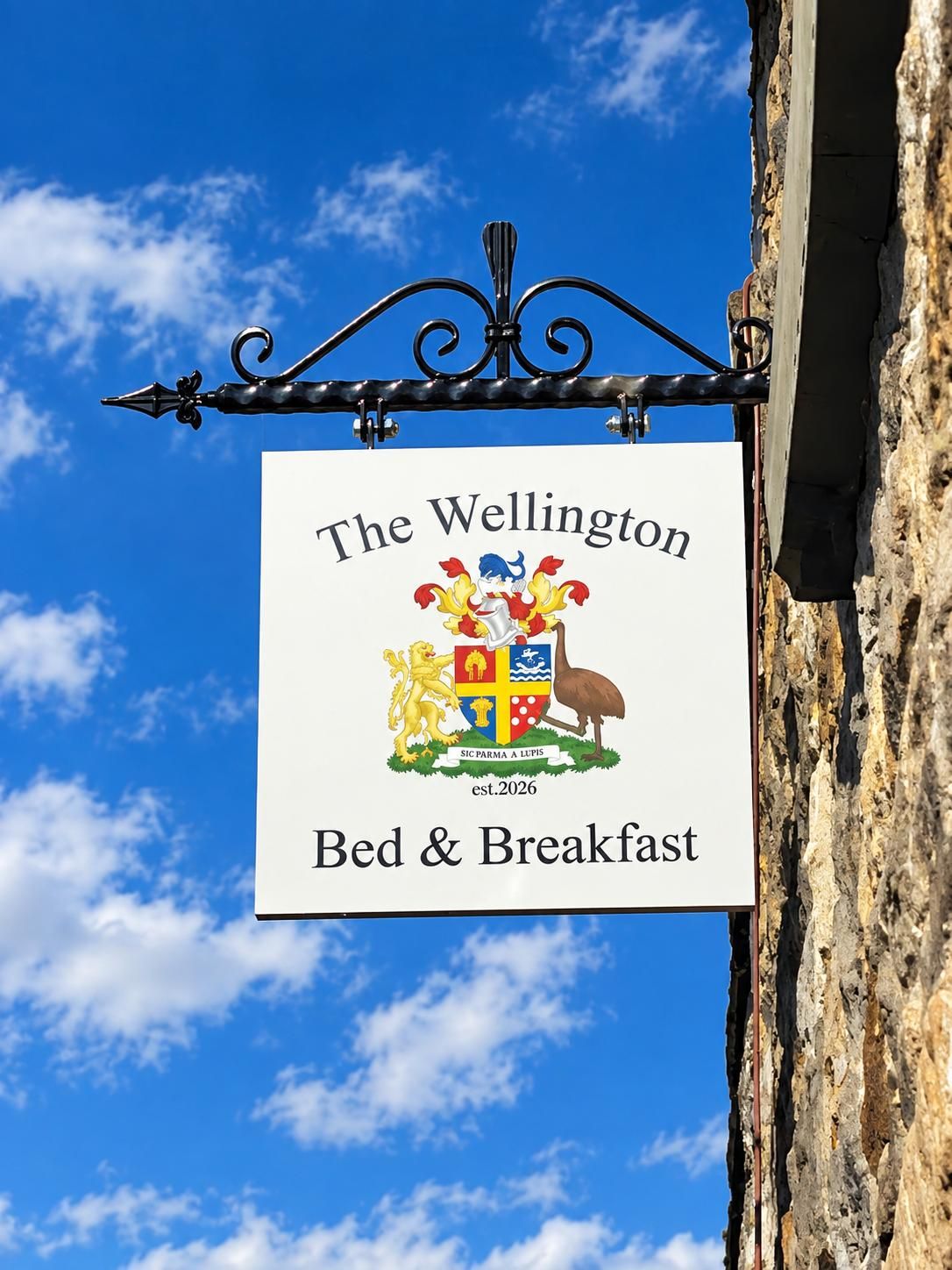 A sign for 'The Wellington Bed & Breakfast' with a coat of arms.