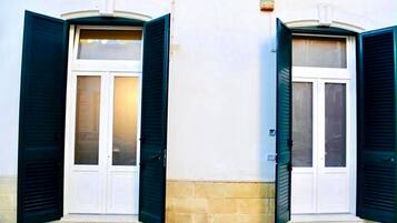 A building with two doors, each with a window above.
