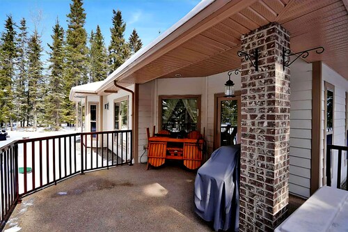 Chateau country cottage-inspired retreat on 5 majestic, wooded acres.