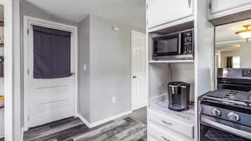 Bright updated kitchen with coffee station and stainless gas range