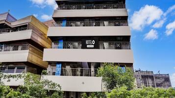 A multi-story hotel with a prominent 'HOTEL' sign on the facade.