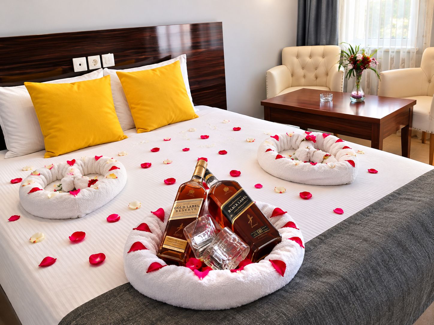 A hotel room with a neatly made bed, two yellow pillows, a wooden headboard, a bedside table with a vase of flowers, and a chair.