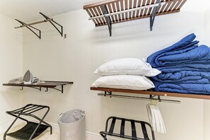 A laundry area with hanging racks, a drying rack, and a storage basket. - Private Pool, Pickleball, Mini Golf, Game Room, Near AMI (Bradenton)