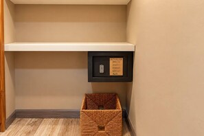 A storage area with a shelf and a framed sign. - Central Sosua 1BR , Balcony , Hard Rock Perks (Sosúa)