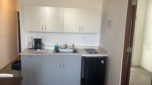 A compact kitchenette with a sink, a coffee maker, and a small refrigerator. - Apt with Terrace near Beaches & Old San Juan-21 (San Juan)