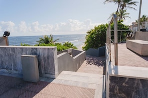 A concrete staircase leading to a balcony overlooking the ocean. - Penthouse with Terrace, Near Old San Juan and Condado-10 (San Juan)