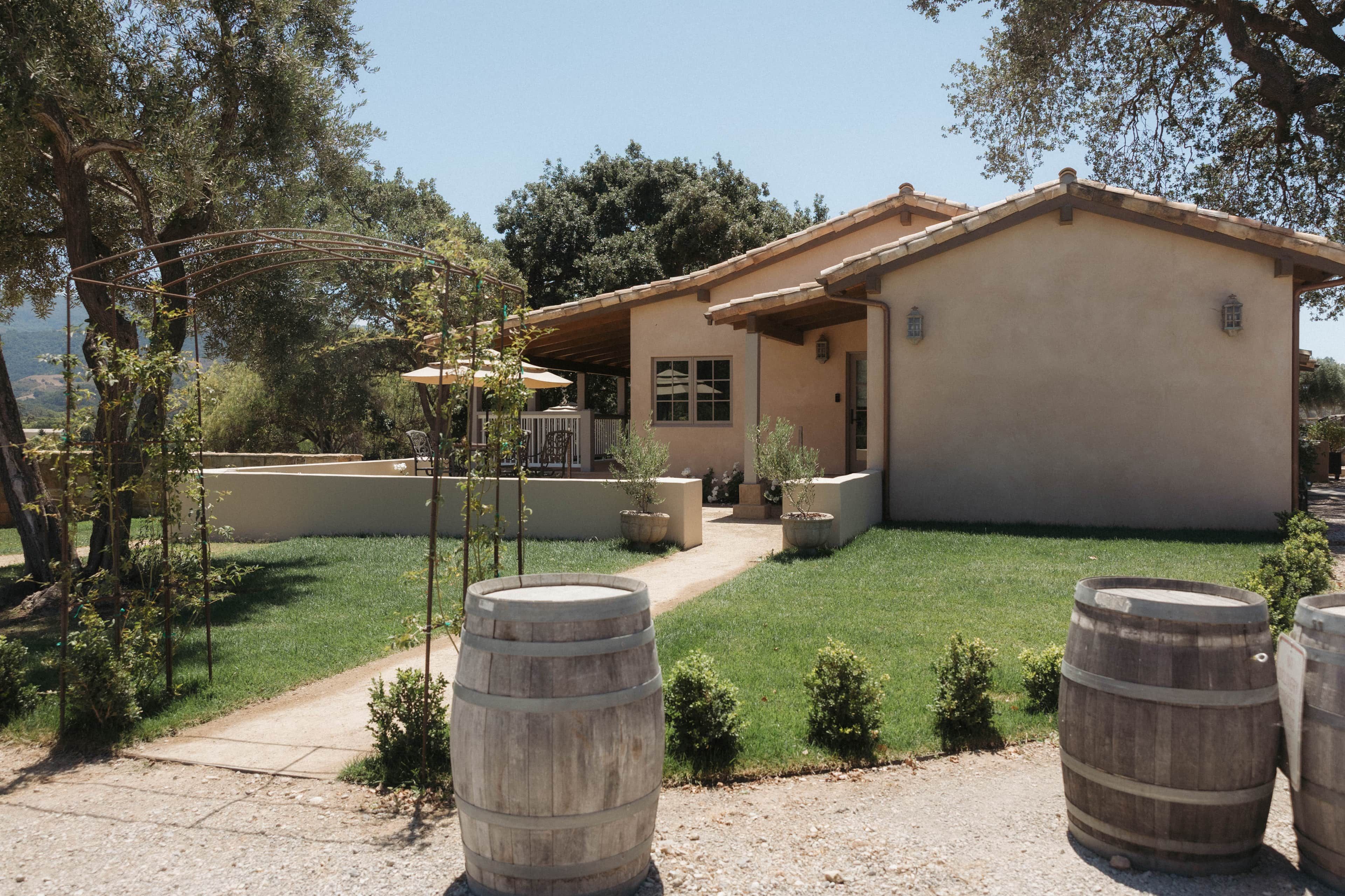 A house with a patio, a pergola, and a view of the countryside.