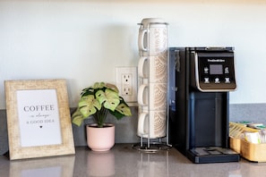 A kitchen counter with a coffee maker, a framed quote, and a potted plant. - Beyond Horizon, Private Casita, Stargazing & Fast WiFi (Joshua Tree)